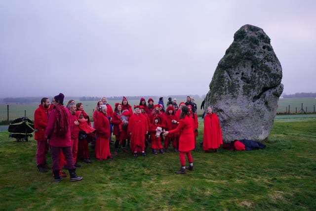 People take part in the winter solstice celebrations at Stonehenge in Wiltshire (Ben Birchall/PA)