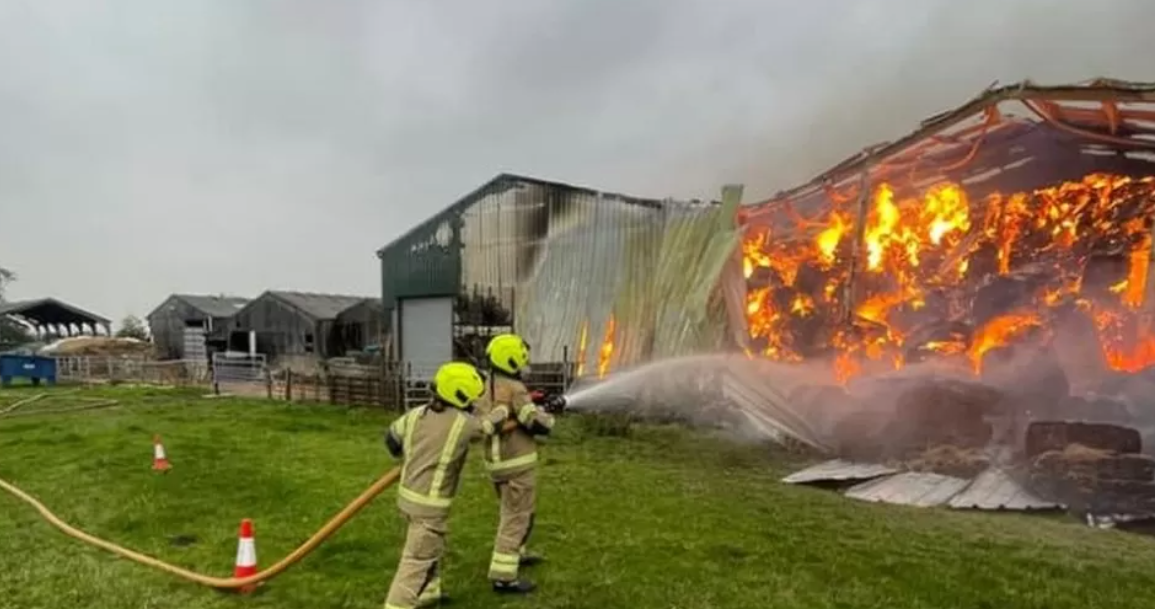 Firefighters tackle the huge fire on a farm in Oxfordshire