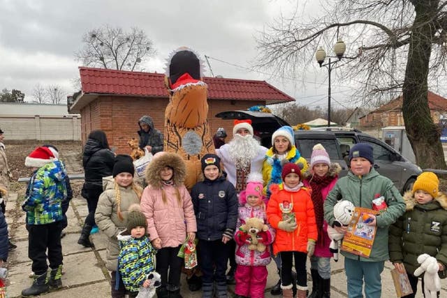 Ukrainian children in Saltivka received gifts from volunteers (Wendy Warrington/PA)