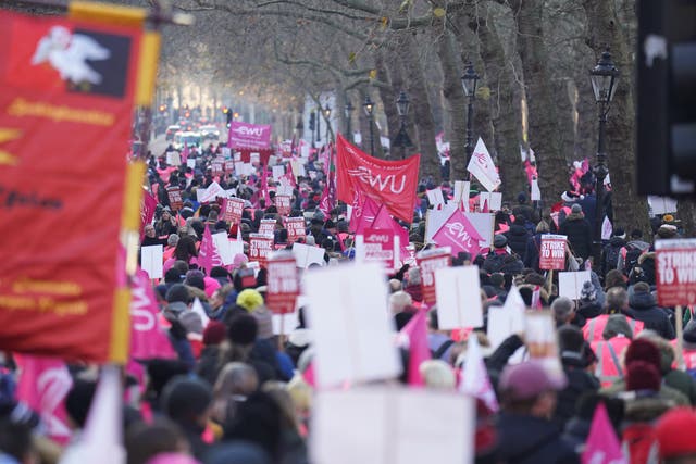 Members of the Communication Workers Union march from Parliament Square to St James’s Park, London, during a rally with Royal Mail workers to mark another strike in the increasingly bitter dispute over jobs, pay and conditions (James Manning/PA)