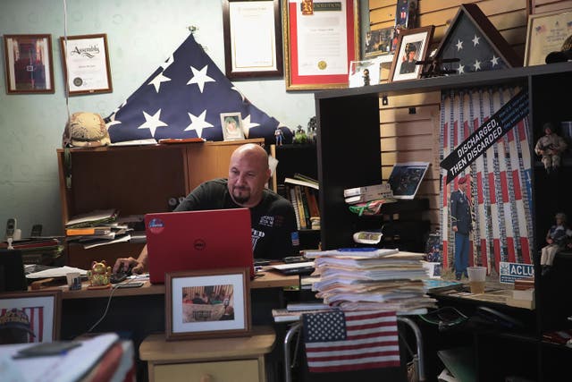 <p>Hector Barajas, who founded and runs Deported Veterans Support House, works in his office on January 28, 2019 in Tijuana, Mexico</p>