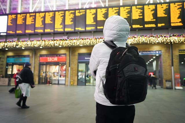 Millions of people embarking on Christmas getaways face disruption from strikes and congestion (James Manning/PA)