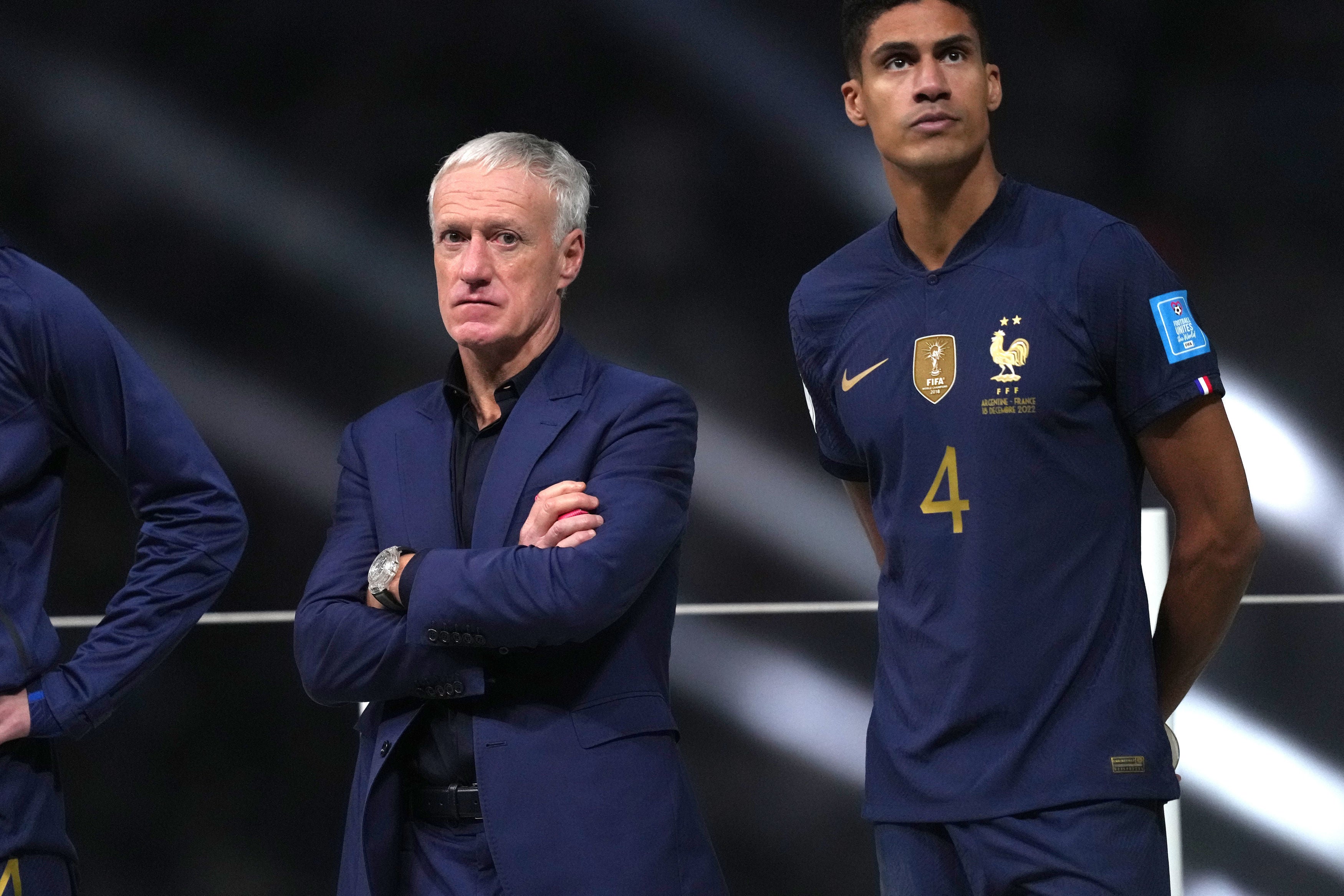 France manager Didier Deschamps and Raphael Varane look dejected following defeat