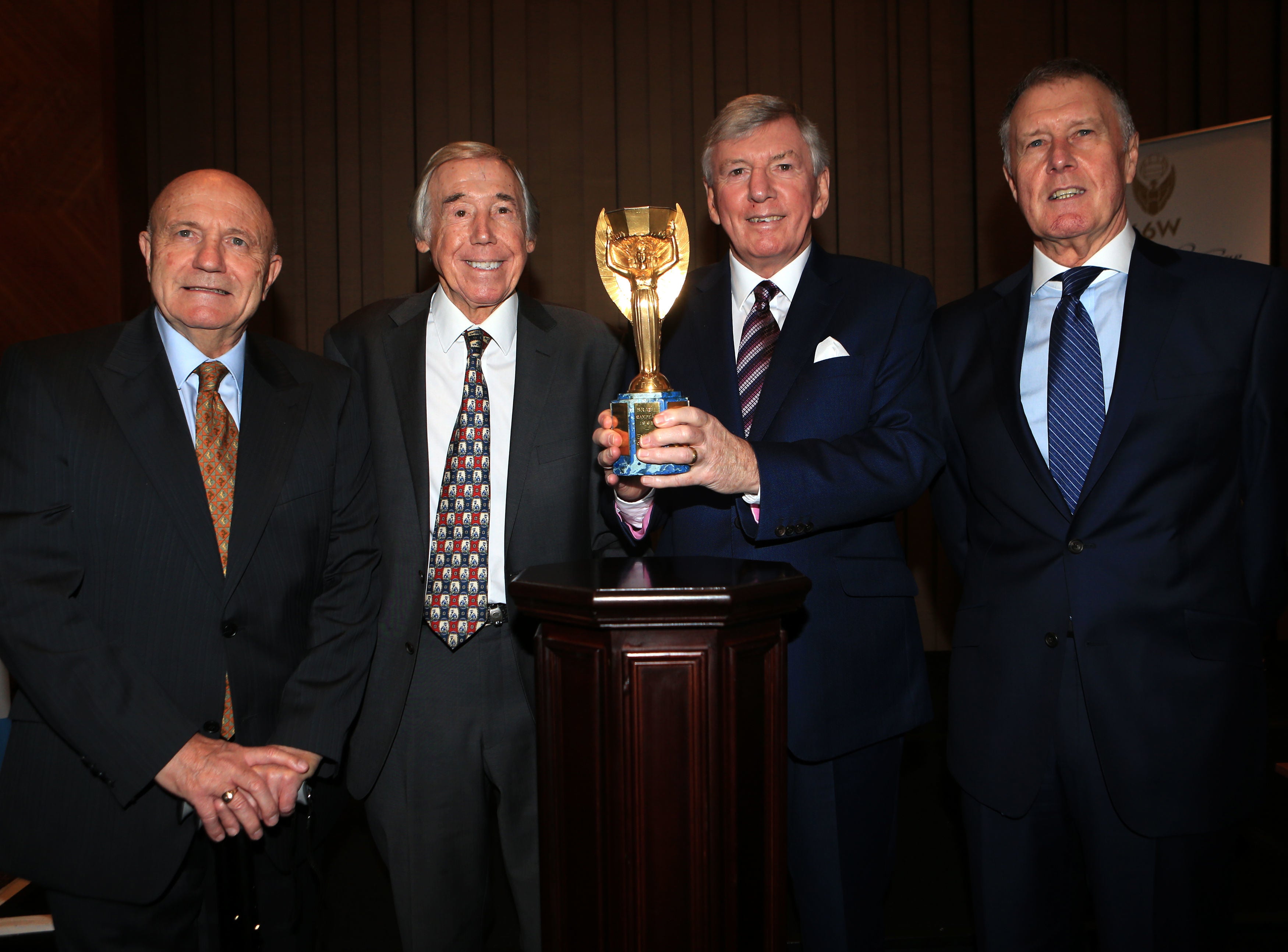 Boys of 66: Cohen, Gordon Banks, Martin Peters and Sir Geoff Hurst pose with the Jules Rimet trophy in 2016