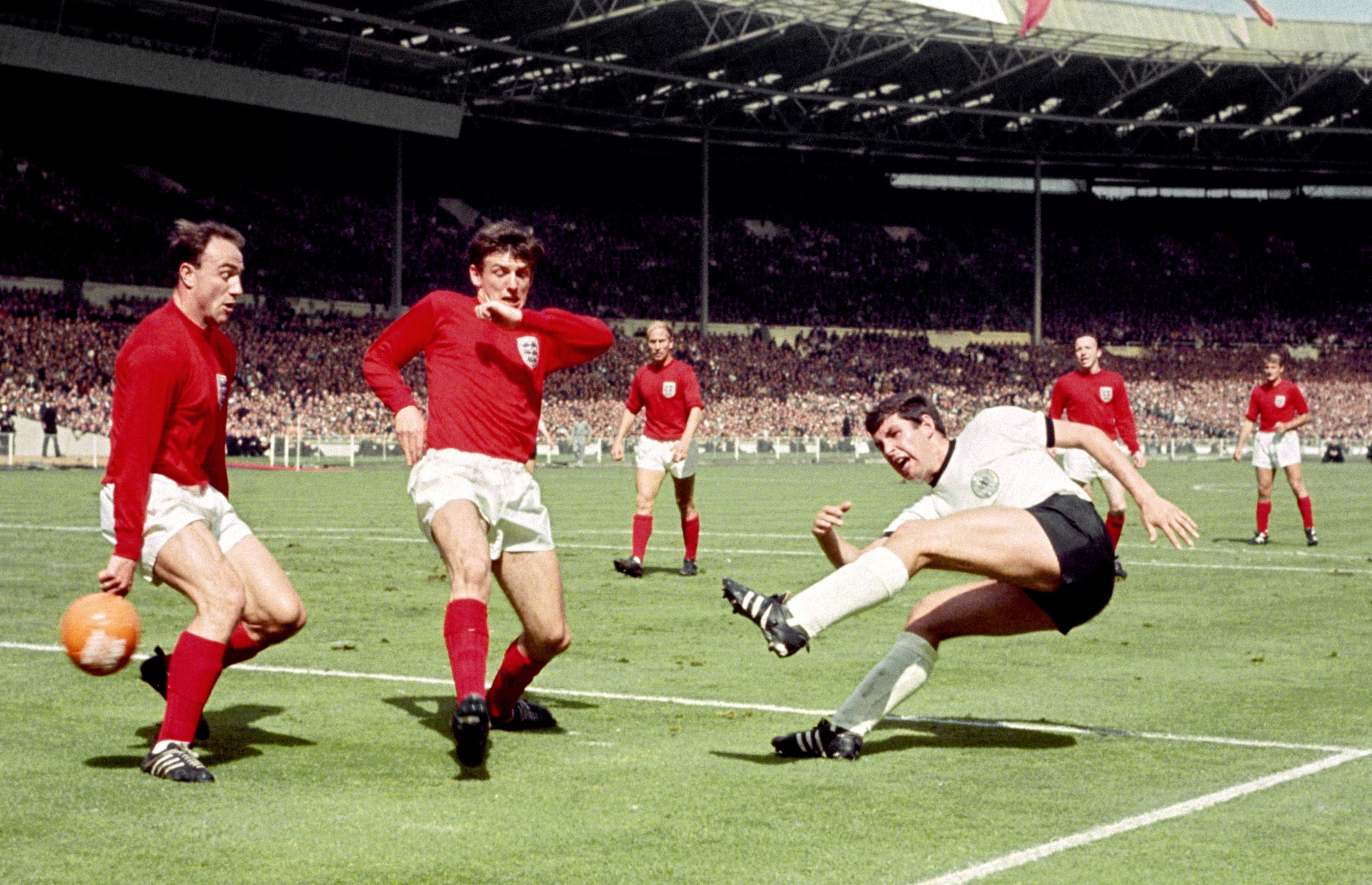 George Cohen, left, in action during the 1966 World Cup final