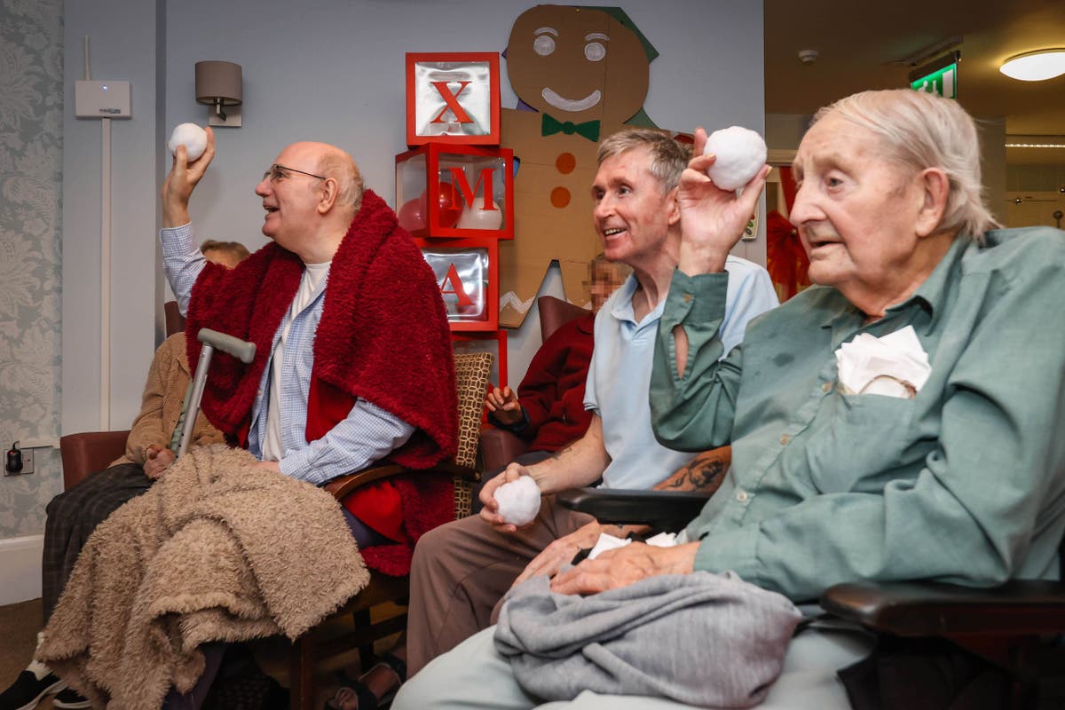 Indoor snowball fight at care home enjoying first restriction-free Christmas