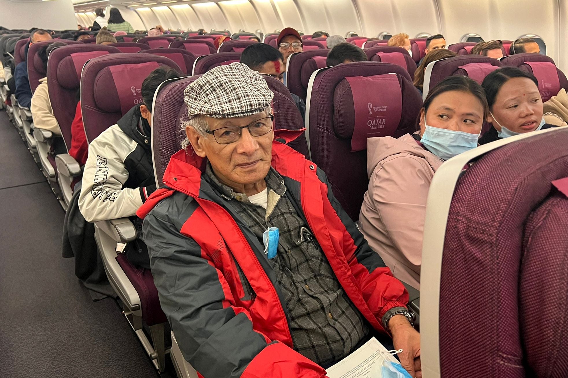 French serial killer Charles Sobhraj sits in an aircraft from Kathmandu to France on 23 December
