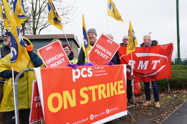 Members of the Public and Commercial Services union on the picket line outside Birmingham Airport (Jacob King/PA)