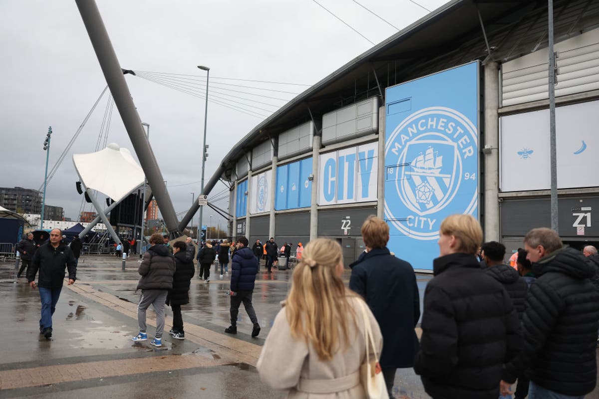 Man City and Liverpool condemn &lsquo;wholly unacceptable&rsquo; incidents after fan injured and coins thrown