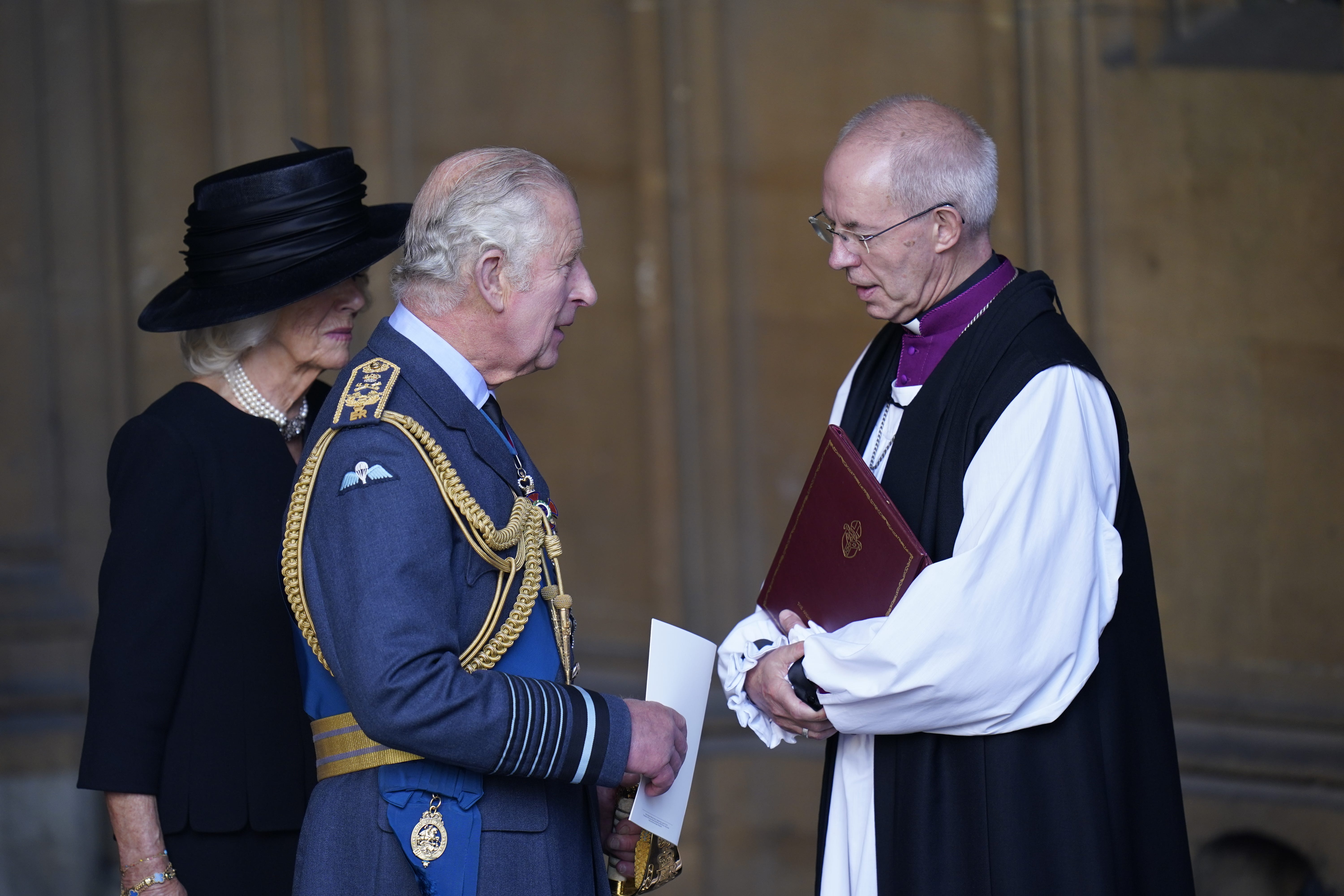 The King and the Queen Consort speak to the Archbishop of Canterbury, Justin Welby (PA)