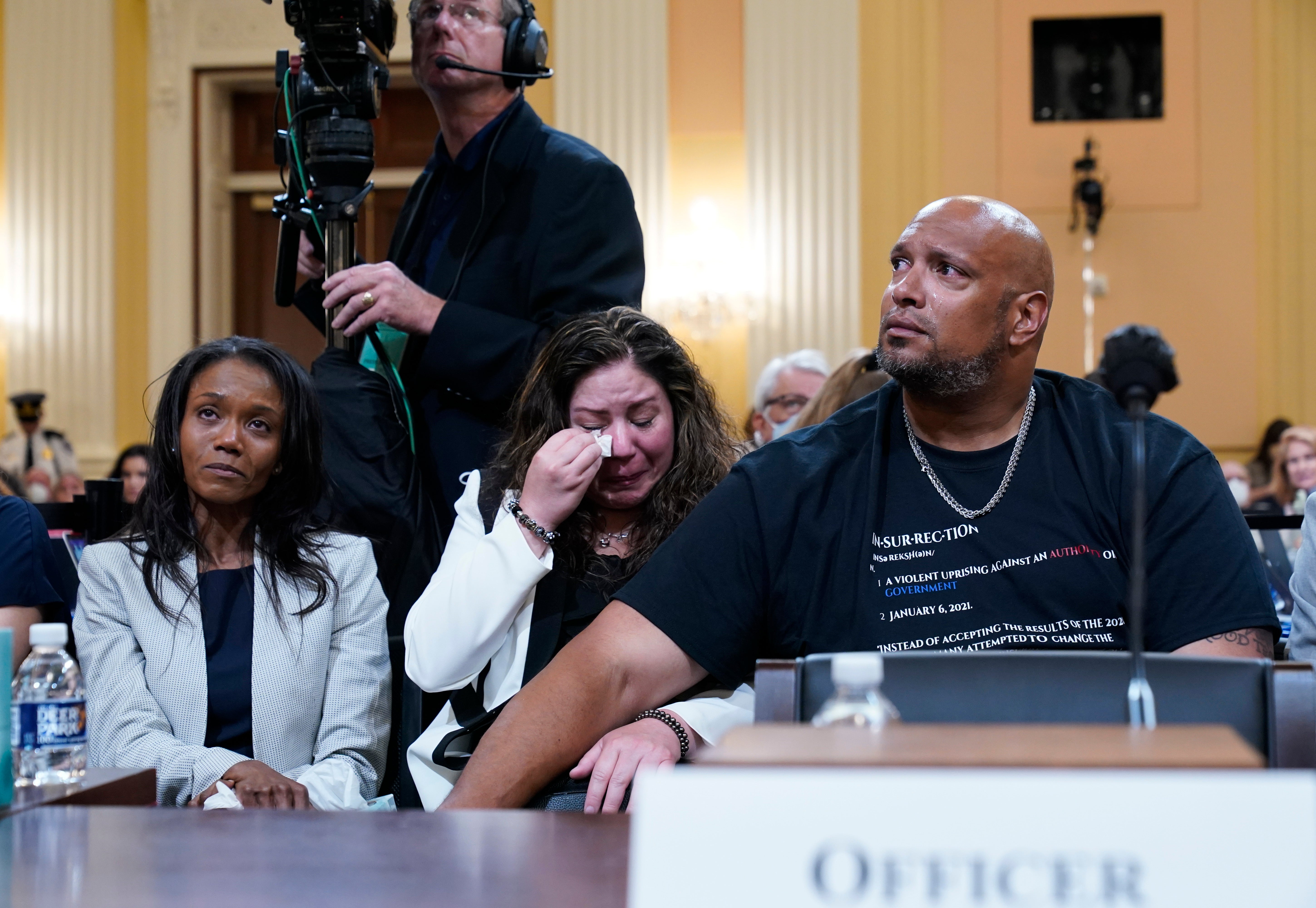 Sandra Garza, the long-time partner of fallen Capitol Police Officer Brian Sicknick, center, as a video of the Jan 6 attack on the US Capitol is played during a public hearing of the House select committee investigating the attack is held on Capitol Hill