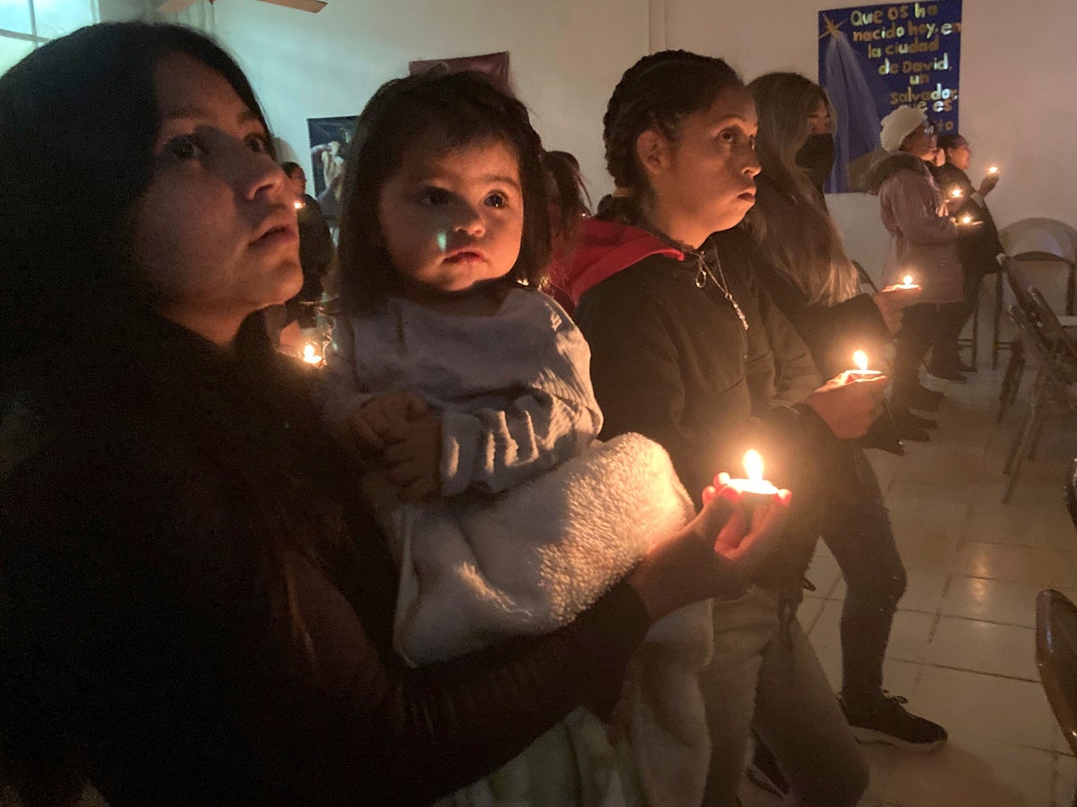 Stuck at the border, migrants find a little Christmas cheer