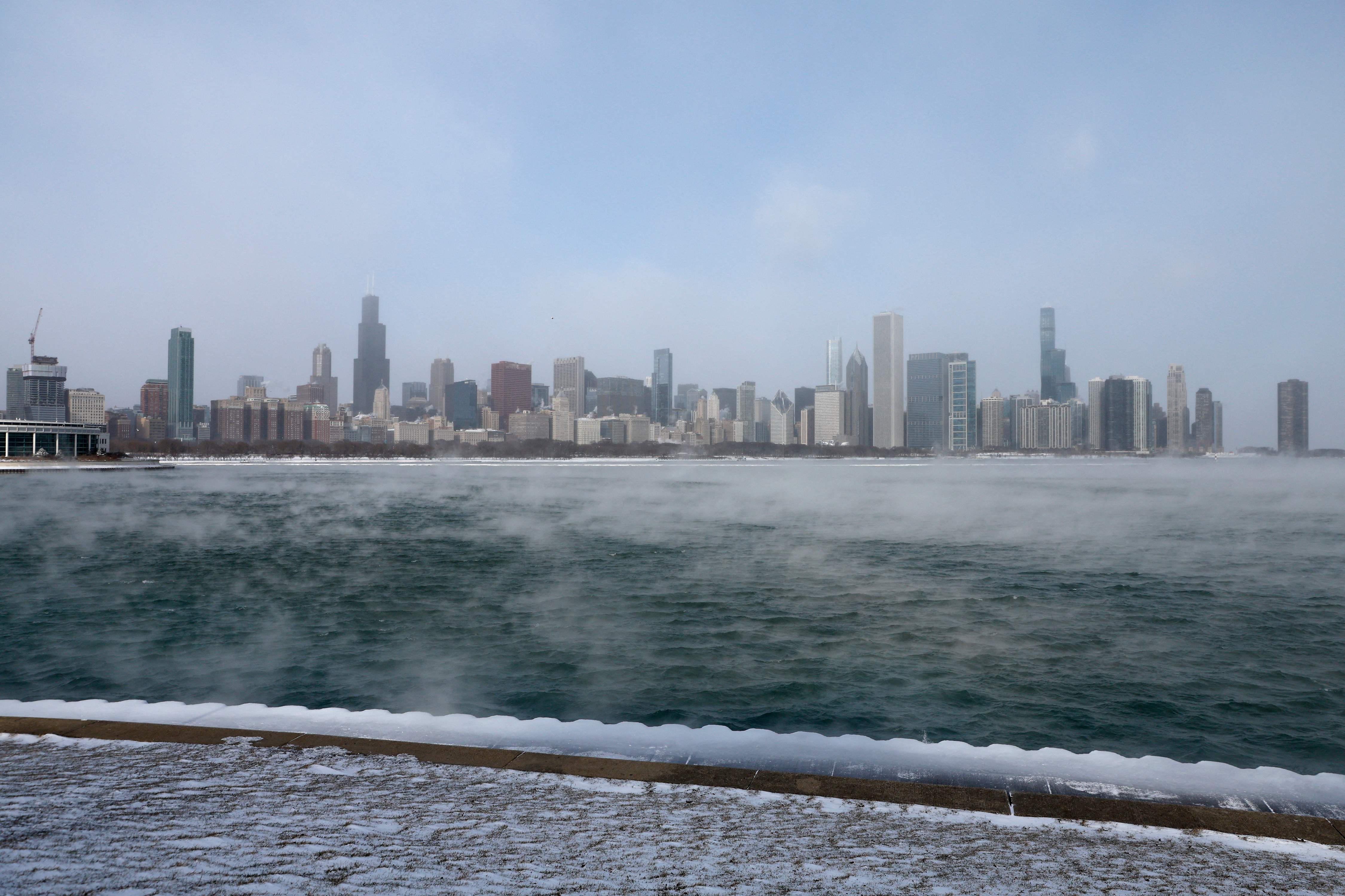 Mist rises from Lake Michigan in Chicago on December 23, 2022, where temperatures reached -6F (-21C) ahead of the Christmas holiday