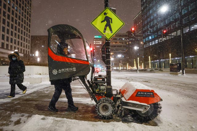 <p>Clearing snow outside the Union Station in Chicago </p>