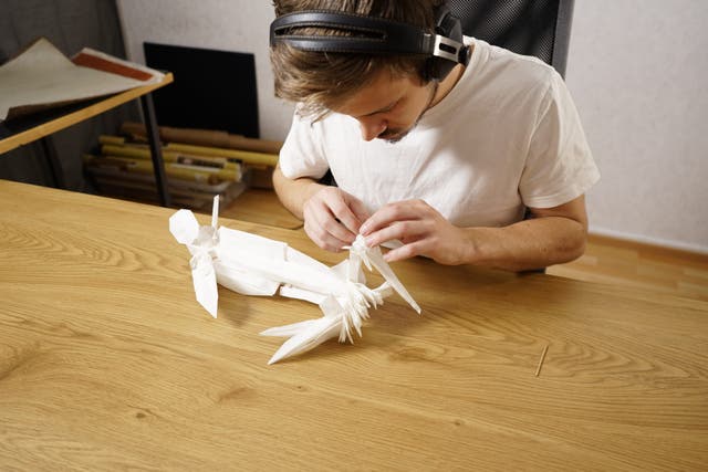 Juho Konkkola with his origami creation (Juho Konkkola/PA)