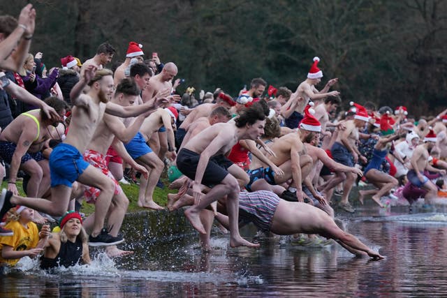 Swimmers take part in the Blackroot Pool Christmas Day swim at Sutton Park, Birmingham (Jacob King/PA)
