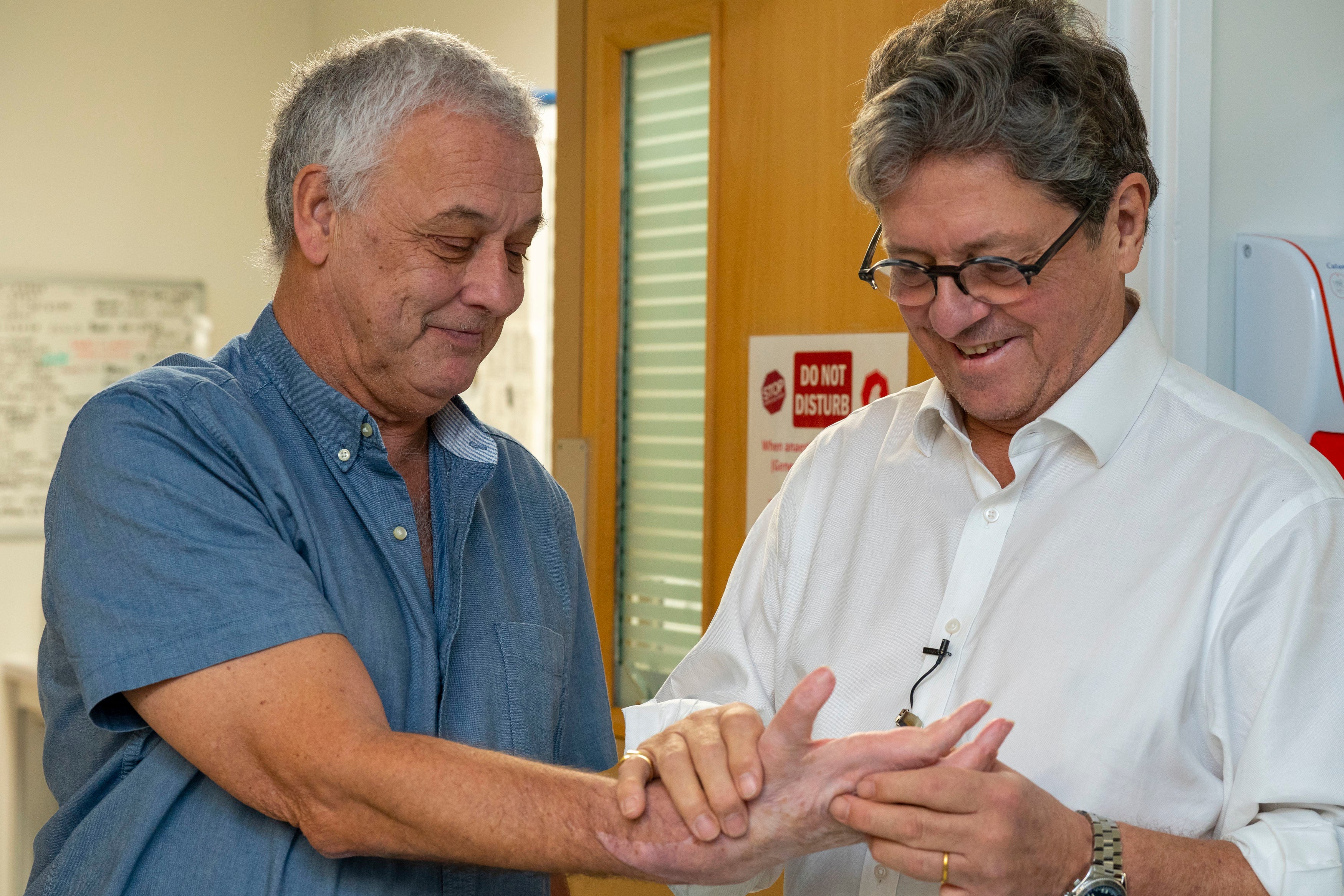 Hand transplant patient Mark Cahill with surgeon Simon Kay at Leeds General Infirmary