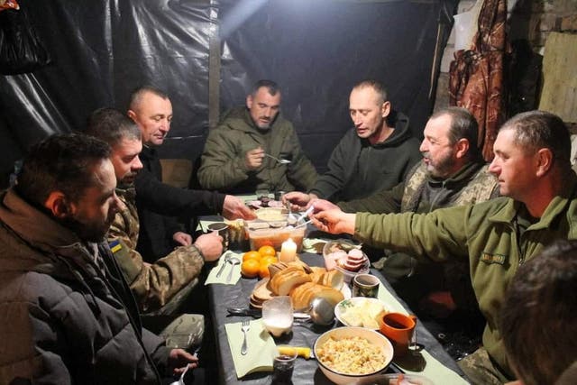 <p>Ukrainian forces at an unknown location have their Christmas lunch</p>