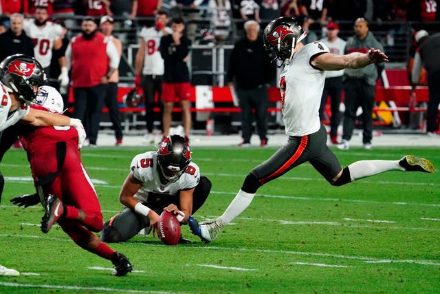 The Tampa Bay Buccaneers kept their playoffs chances alive with a come-from-behind Christmas victory against the Arizona Cardinals (Darryl Webb/AP)