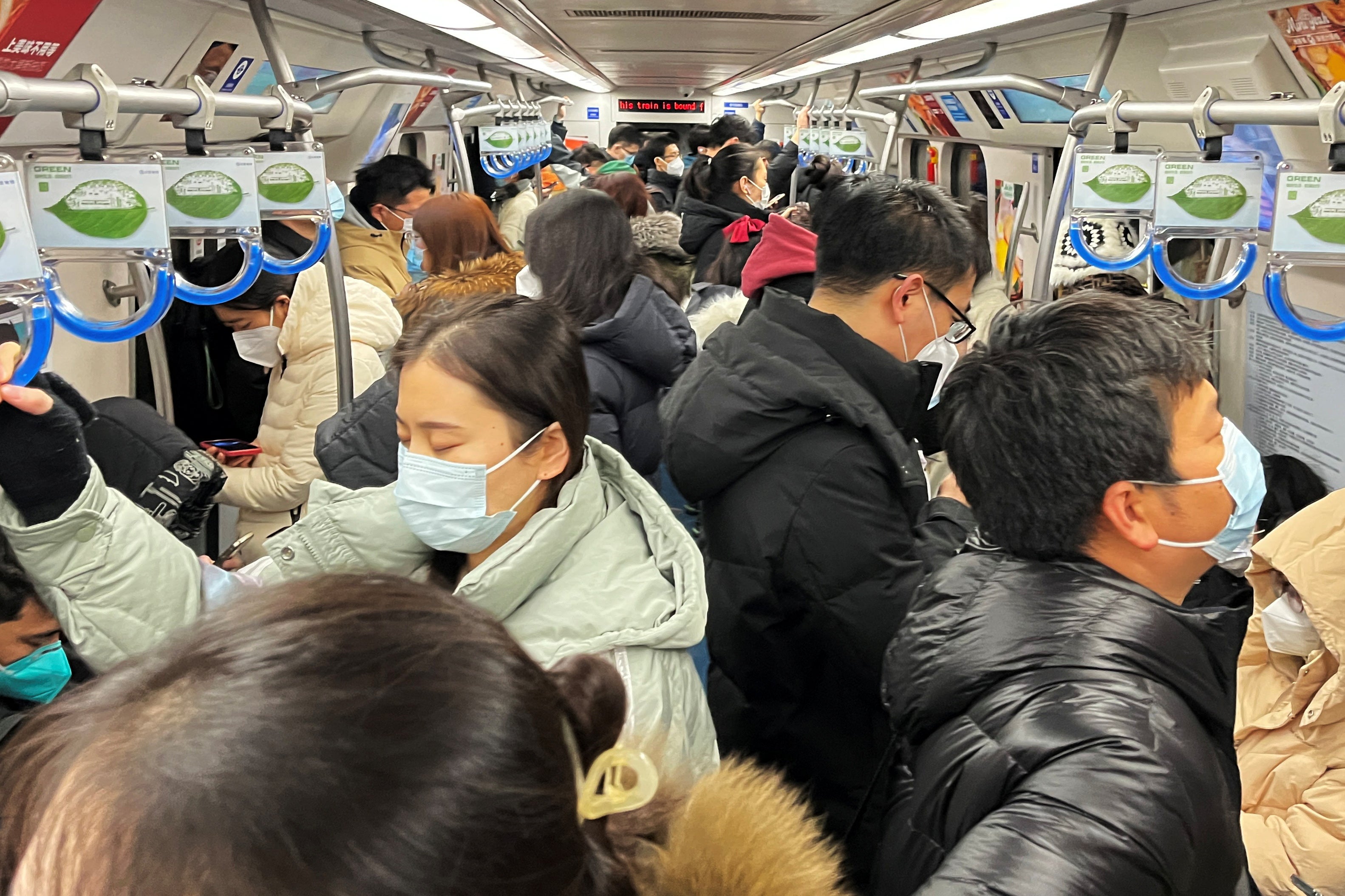 Commuters on a subway train in Beijing on Monday