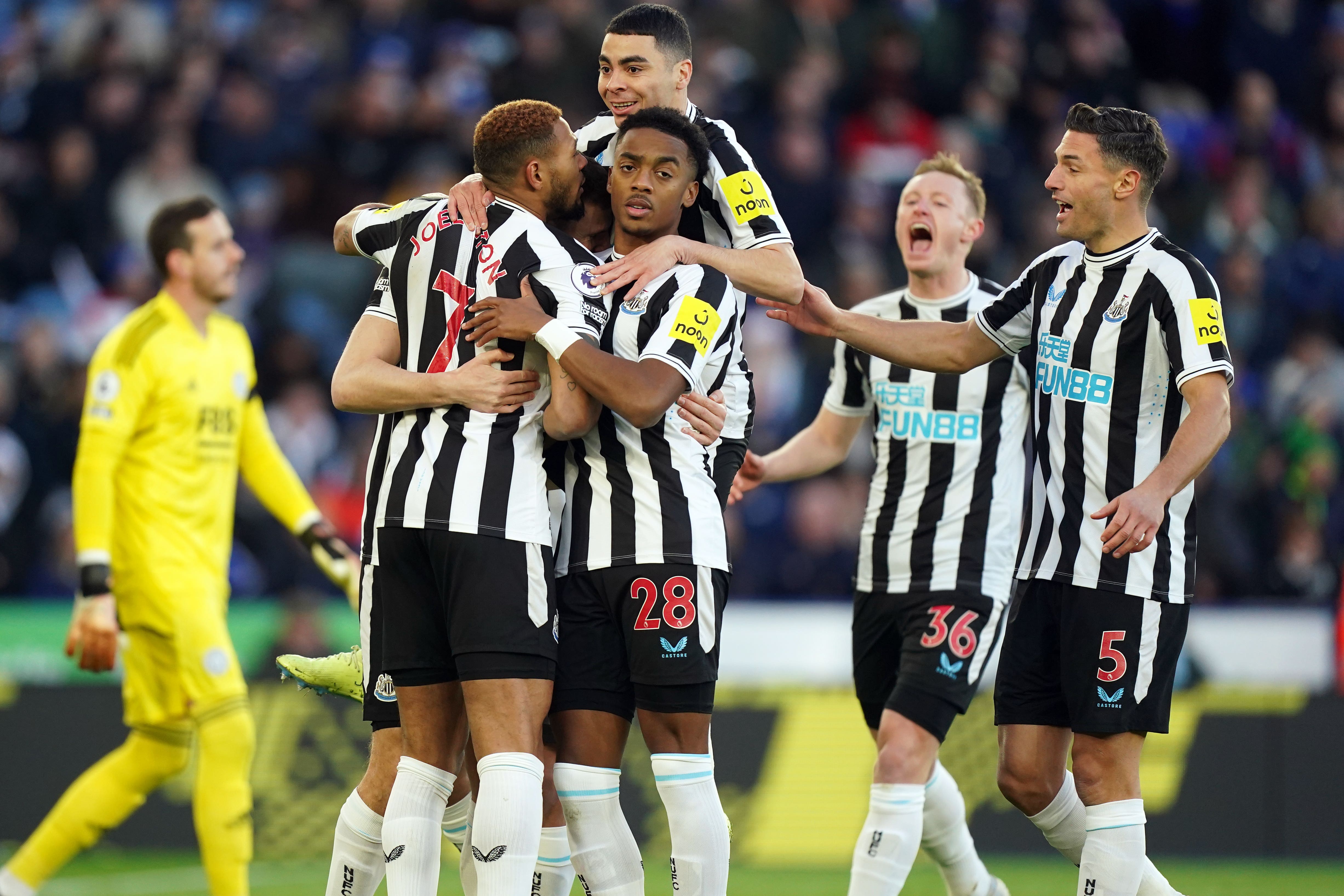 Newcastle players celebrate after scoring at Leicester (Mike Egerton/PA)