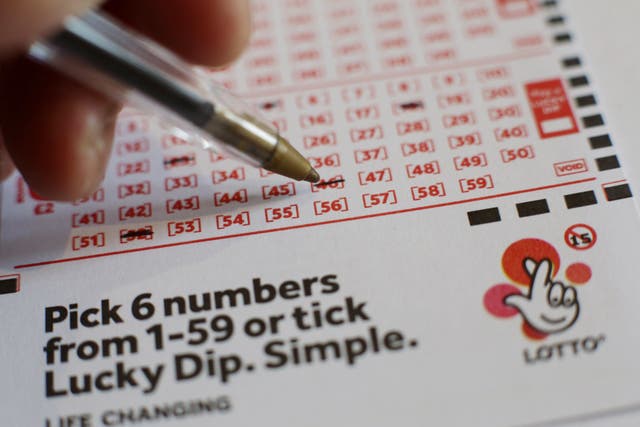 There was more than one millionaire made every day in 2022, the National Lottery said (Yui Mok/PA)