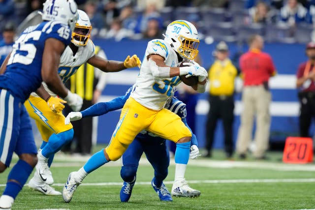 The Los Angeles Chargers clinched their first playoff berth since 2018 to beat the overmatched Indianapolis Colts 20-3 on Monday night (Michael Conroy/AP)