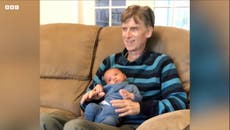 Moment terminally ill grandfather meets his grandchild for the first time