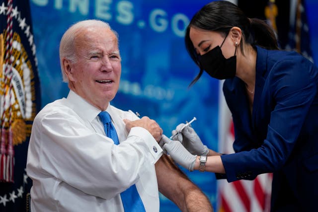 <p>President Joe Biden receives his COVID-19 booster from a member of the White House medical unit during an event in the South Court Auditorium on the White House campus, Oct. 25, 2022, in Washington</p>