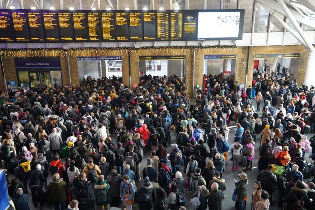 Passengers wait at the barriers at King’s Cross station in London following a strike by members of the Rail, Maritime and Transport union (James Manning/PA)