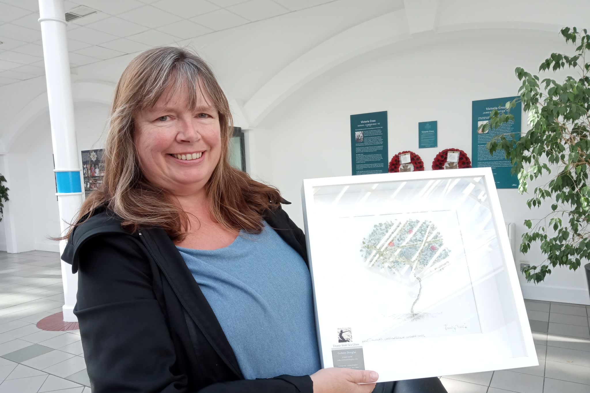 Colleen Douglas with the design for her Tree Of Life sculpture (Mid and East Antrim Council/PA)