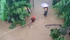 Philippines residents escape floodwaters as landslides and floods kill dozens