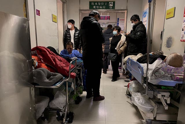 <p>Covid-19 patients on gurneys at Tianjin First Center Hospital in Tianjin, China </p>
