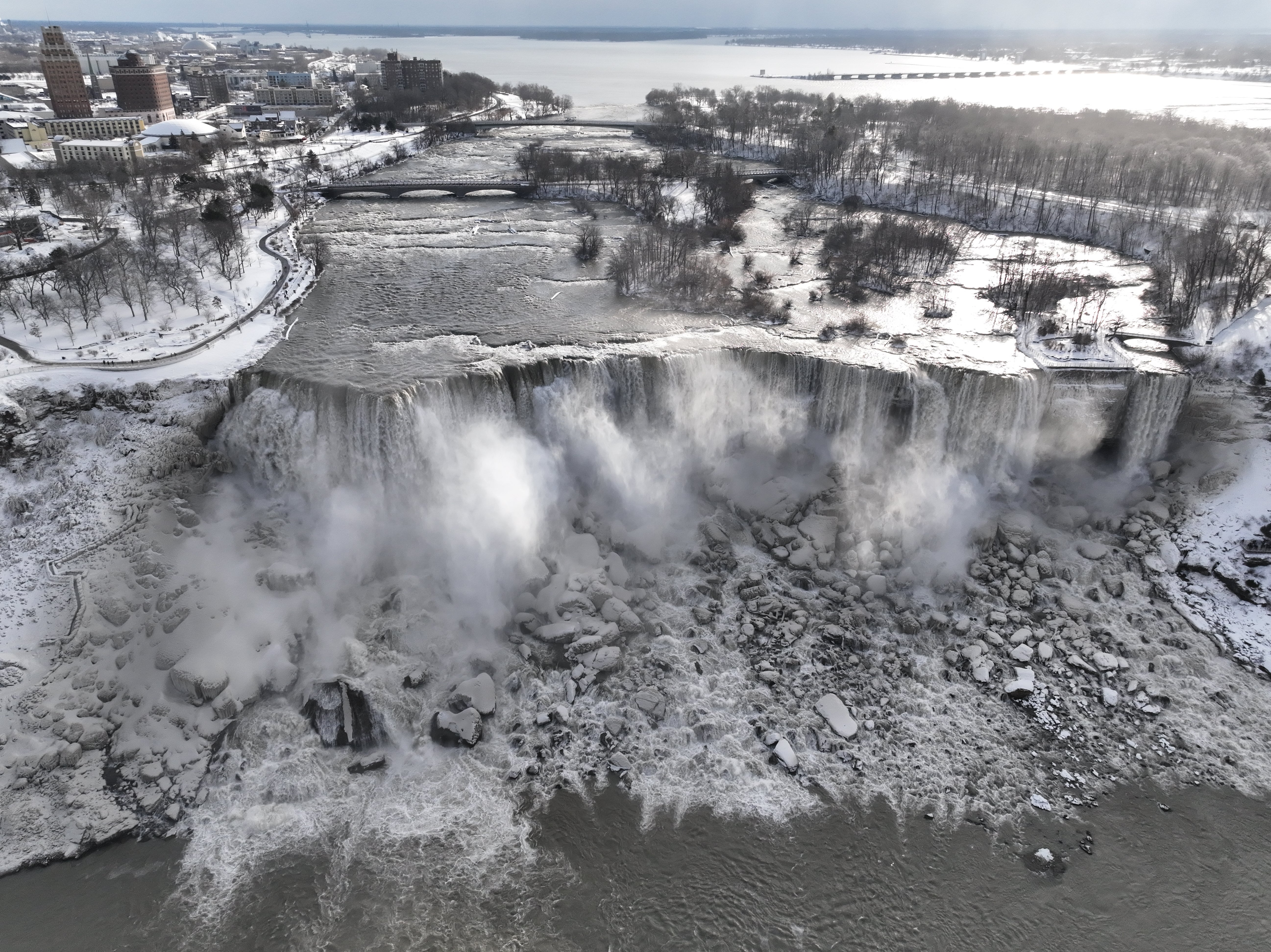 Niagara Falls treated tourists to a magical winter wonderland as it partially froze over during a massive winter storm.