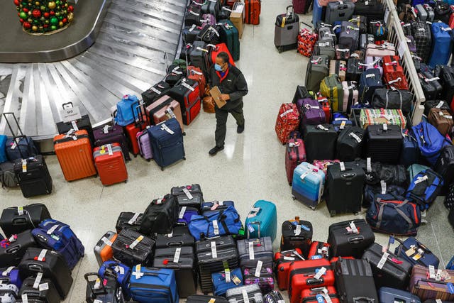 <p>Mountains of bags are seen at Chicago Midway International Airport after flight cancellations</p>
