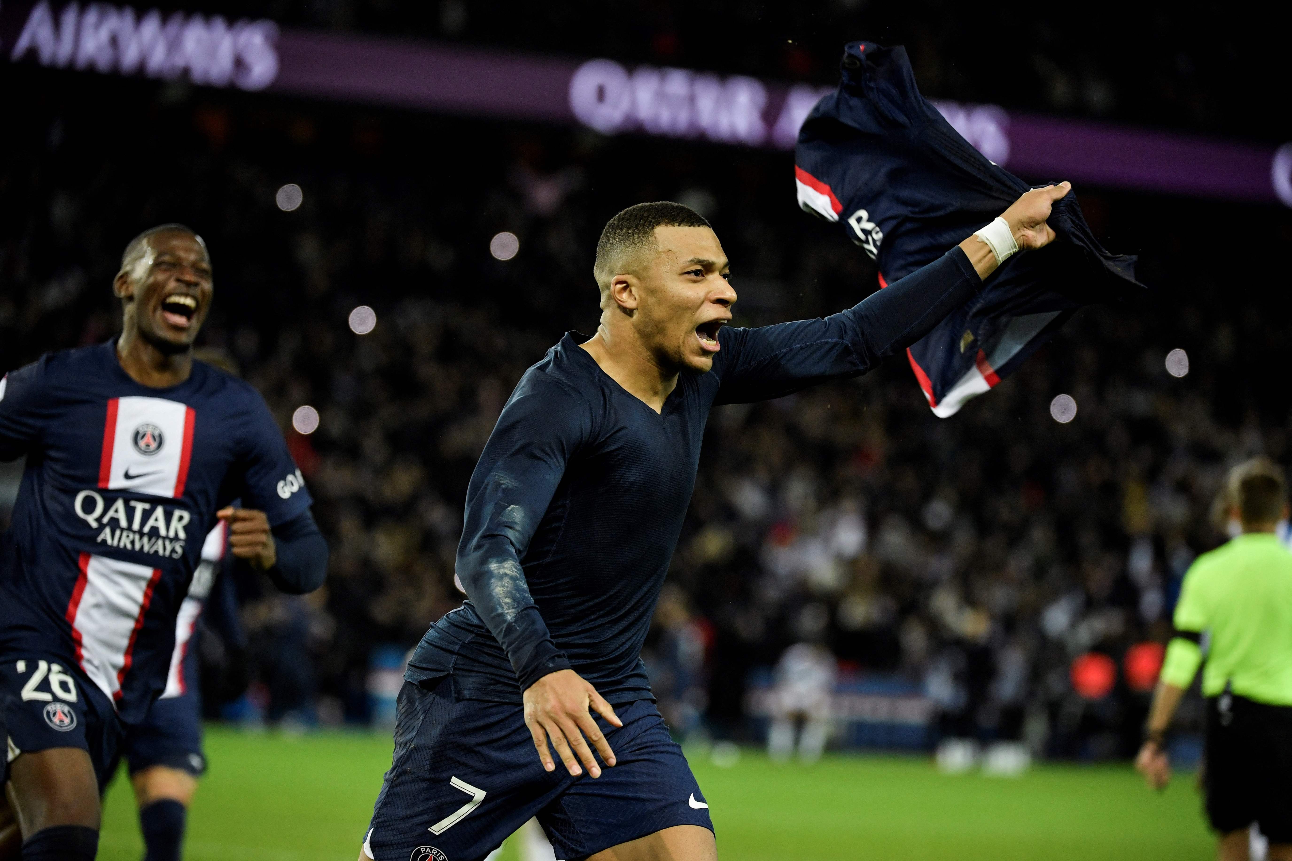 Kylian Mbappe celebrates scoring PSG’s late winner from the spot