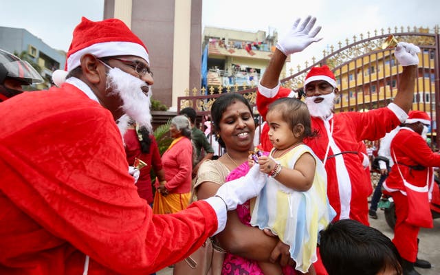 <p>Christian devotees dress up as Santa Claus as part of the Christmas celebrations in Bengaluru, Karnataka</p>