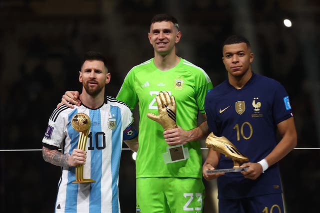 <p>Argentina's Lionel Messi, Golden Glove winner Argentina's Emiliano Martinez and Golden Boot winner France's Kylian Mbappe</p>