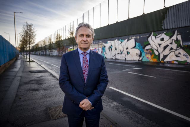 Paddy Harte, chairman of the International Fund for Ireland at a peace wall between the loyalist Shankill Road area and the nationalist Falls Road area (Liam McBurney/PA)
