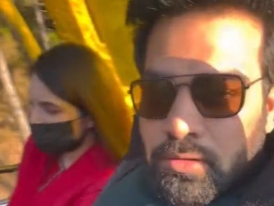 The video shows a ‘husband’ threatening to throw his ‘wife’ out of a cable car
