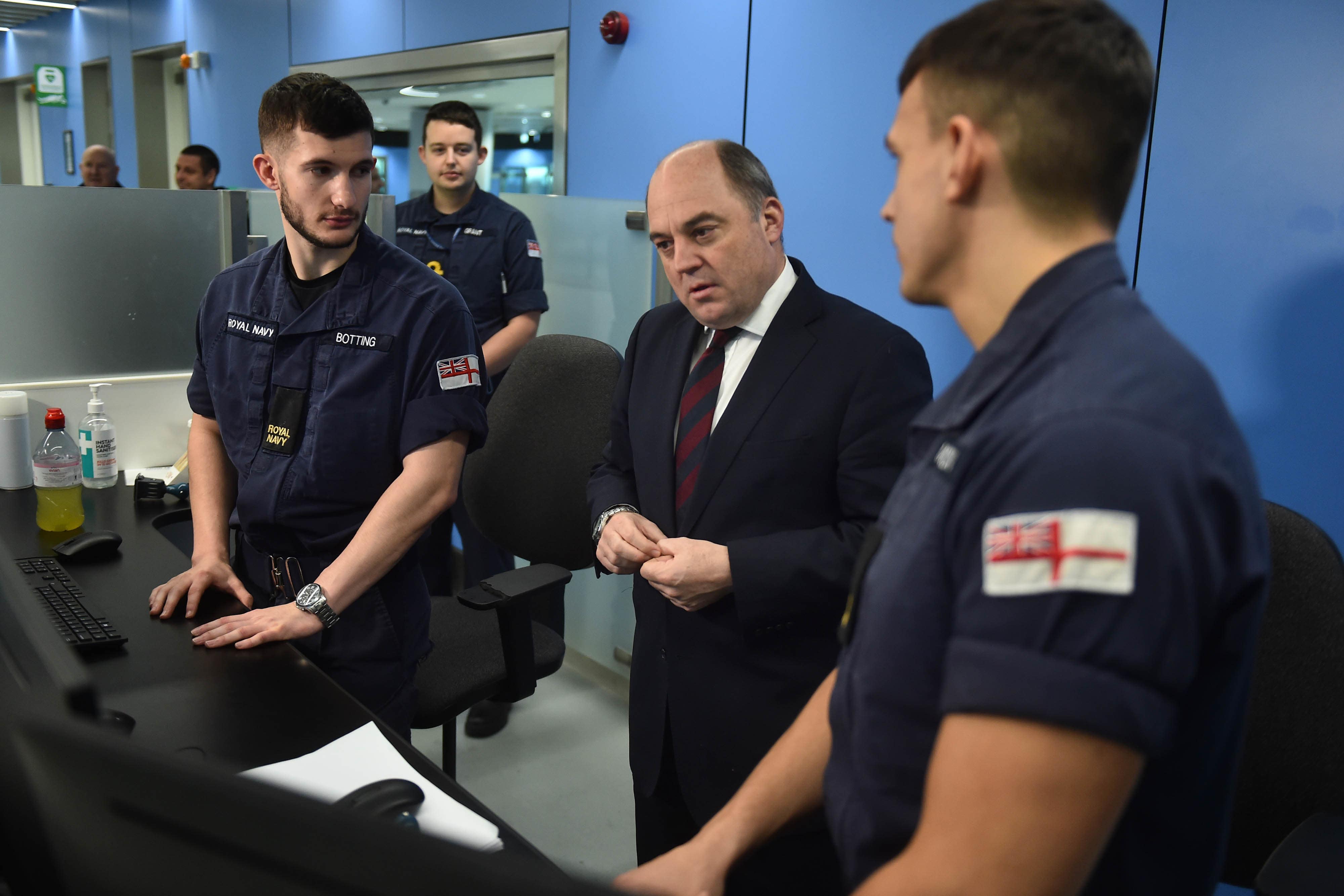Defence Secretary Ben Wallace meets Royal Navy personnel covering for striking Border force staff at Manchester Airport (Peter Powell/PA)