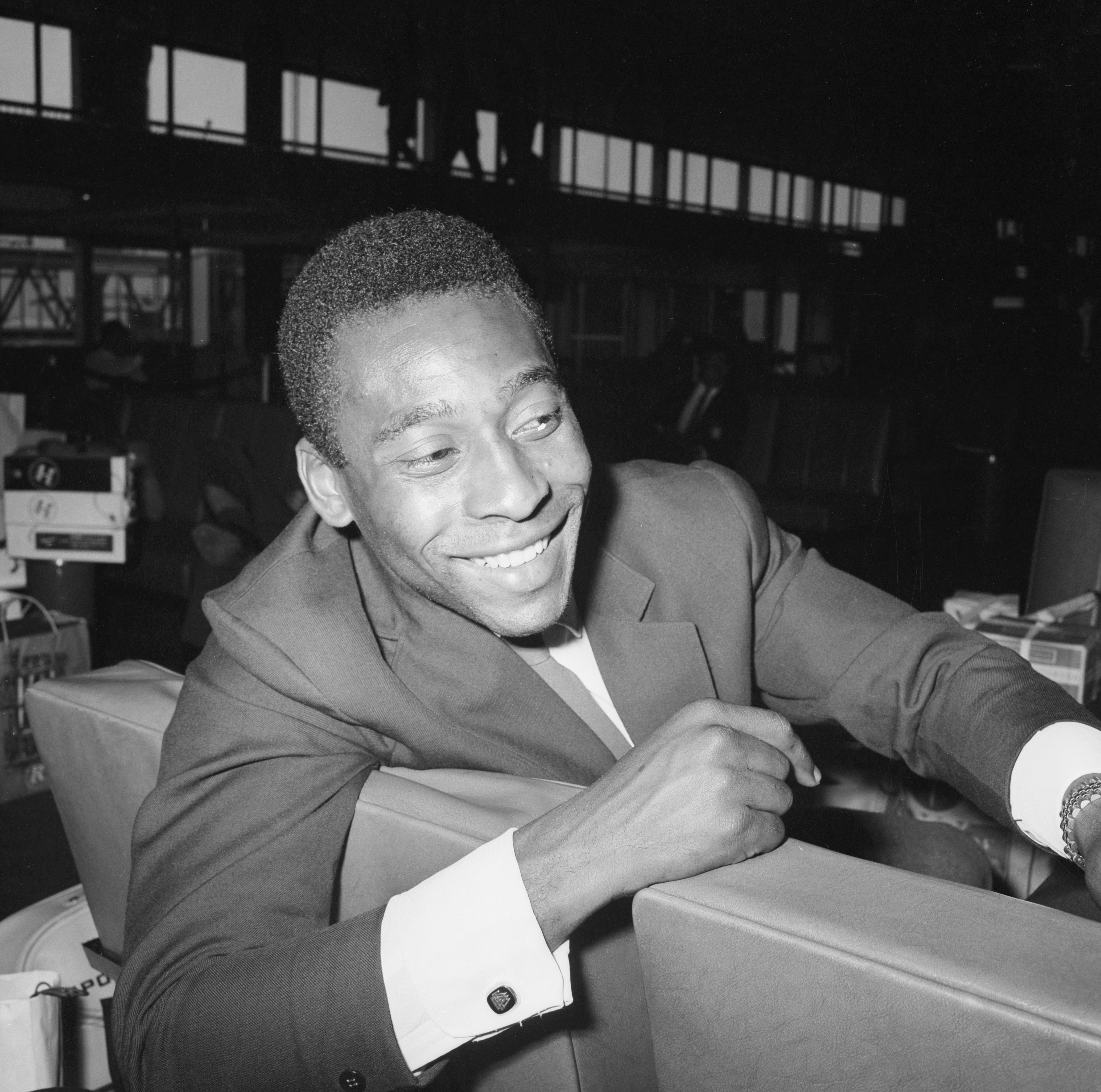 Brazilian footballer Pele waiting at London Airport for his team's plane home after the 1966 World Cup in England, 25th July 1966.
