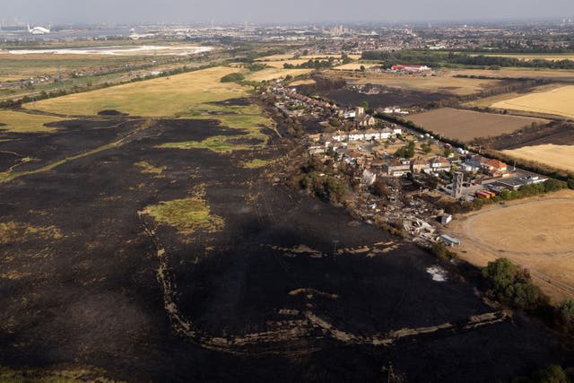 The scene after wildfires devastated the village of Wennington in east London in July 2022 (Aaron Chown/PA)