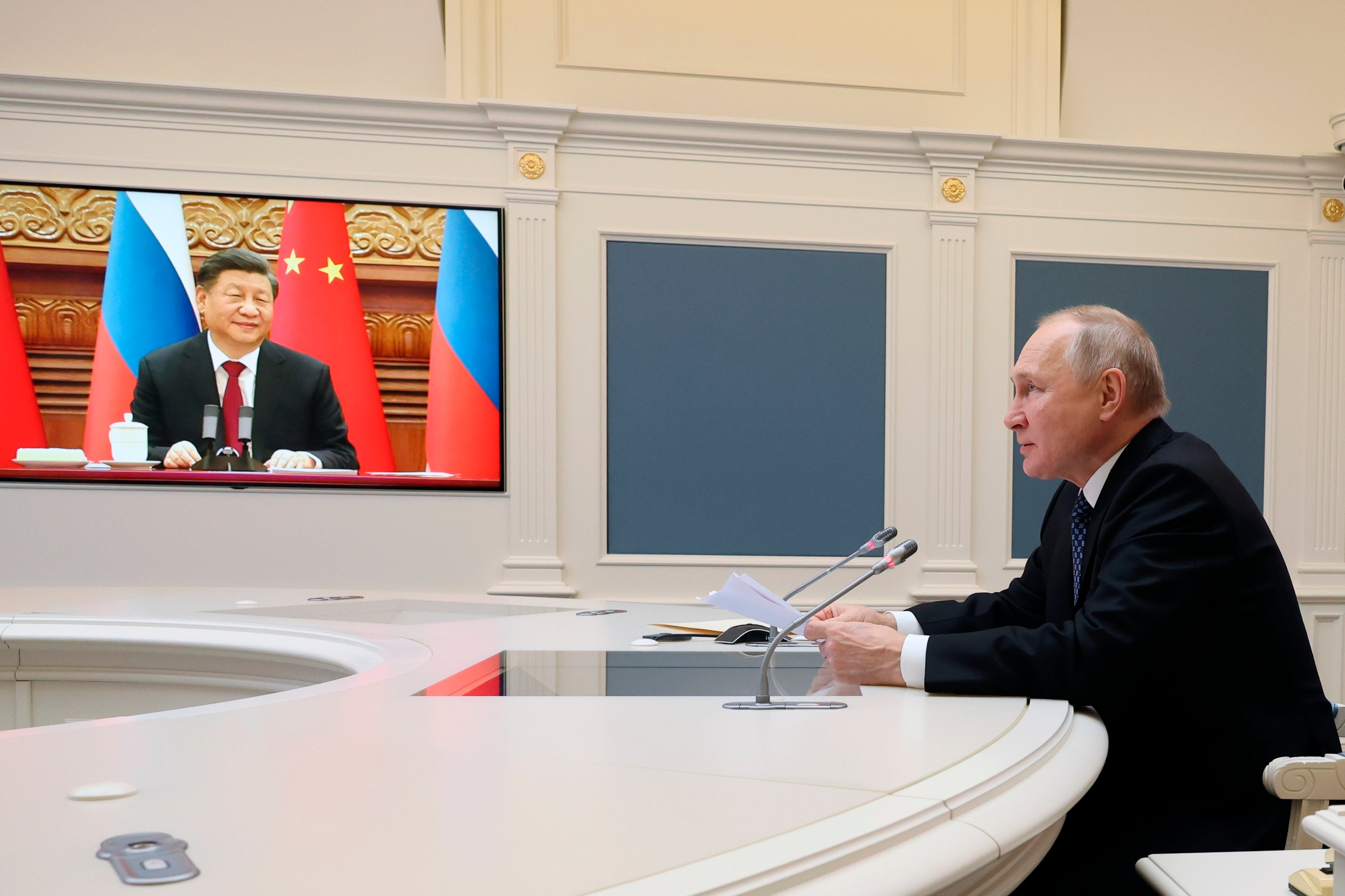 Russian President Vladimir Putin speaks with China President Xi Jinping in December 2022