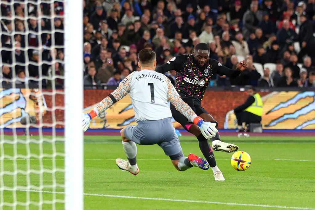 Josh Dasilva of Brentford scores their side's second goal past Lukasz Fabianski of West Ham