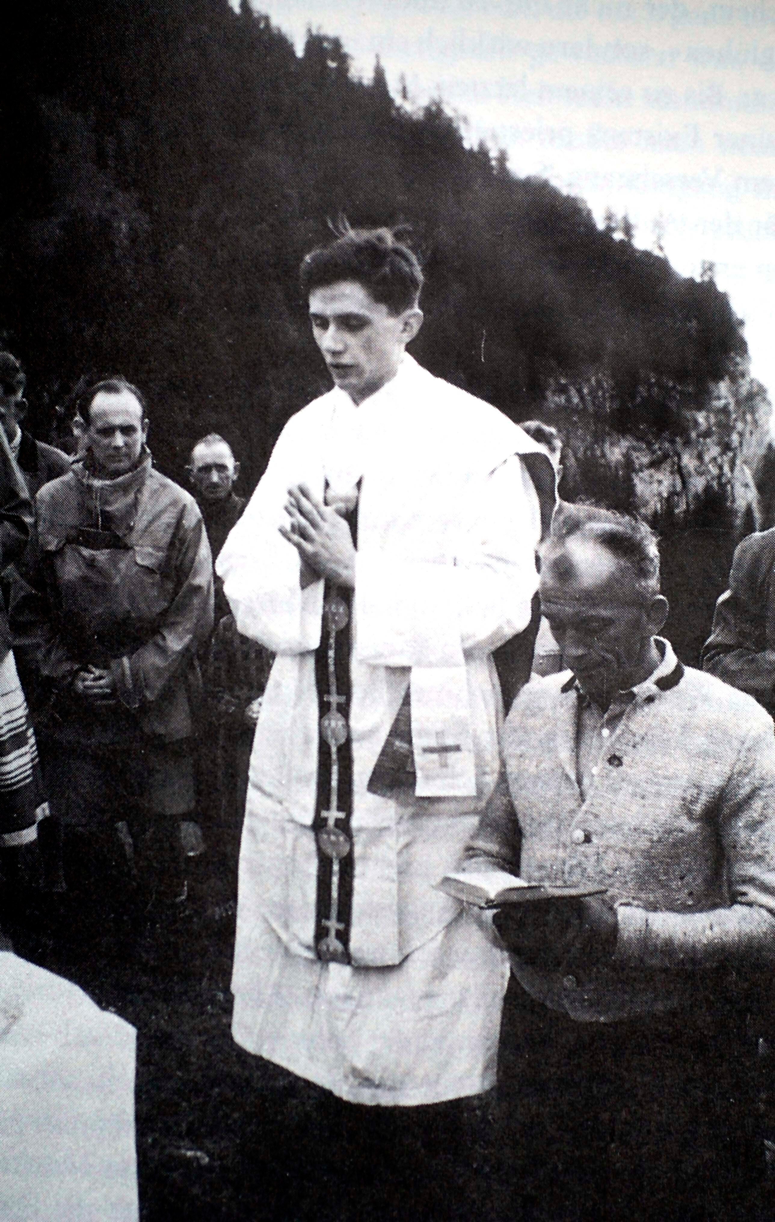 Priest Joseph Ratzinger prays during an open air Mass in Ruhpolding, southern Germany, in 1952