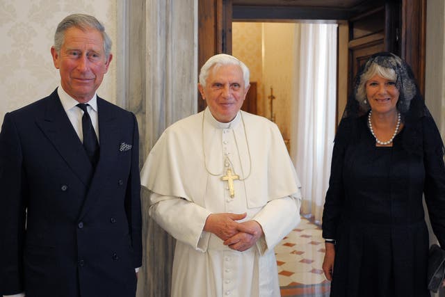 <p>Pope Benedict XVI (C) poses with Britain's Prince Charles (L) and his wife Camilla (R), Duchess of Cornwall prior their meeting in his private library at the Vatican on April 27, 2009</p>