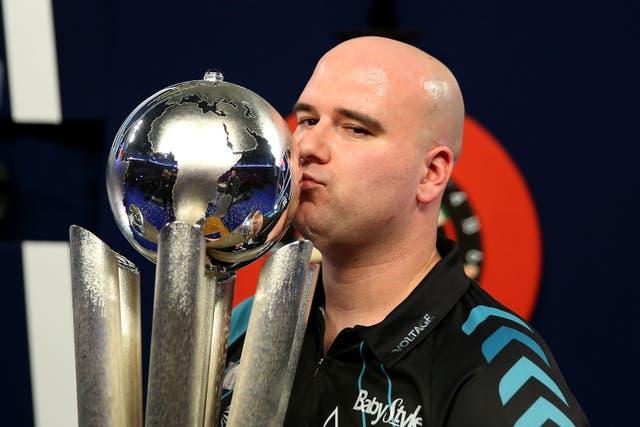 Rob Cross celebrates his stunning victory over Phil Taylor in the 2018 World Championship final (Steven Paston/PA)