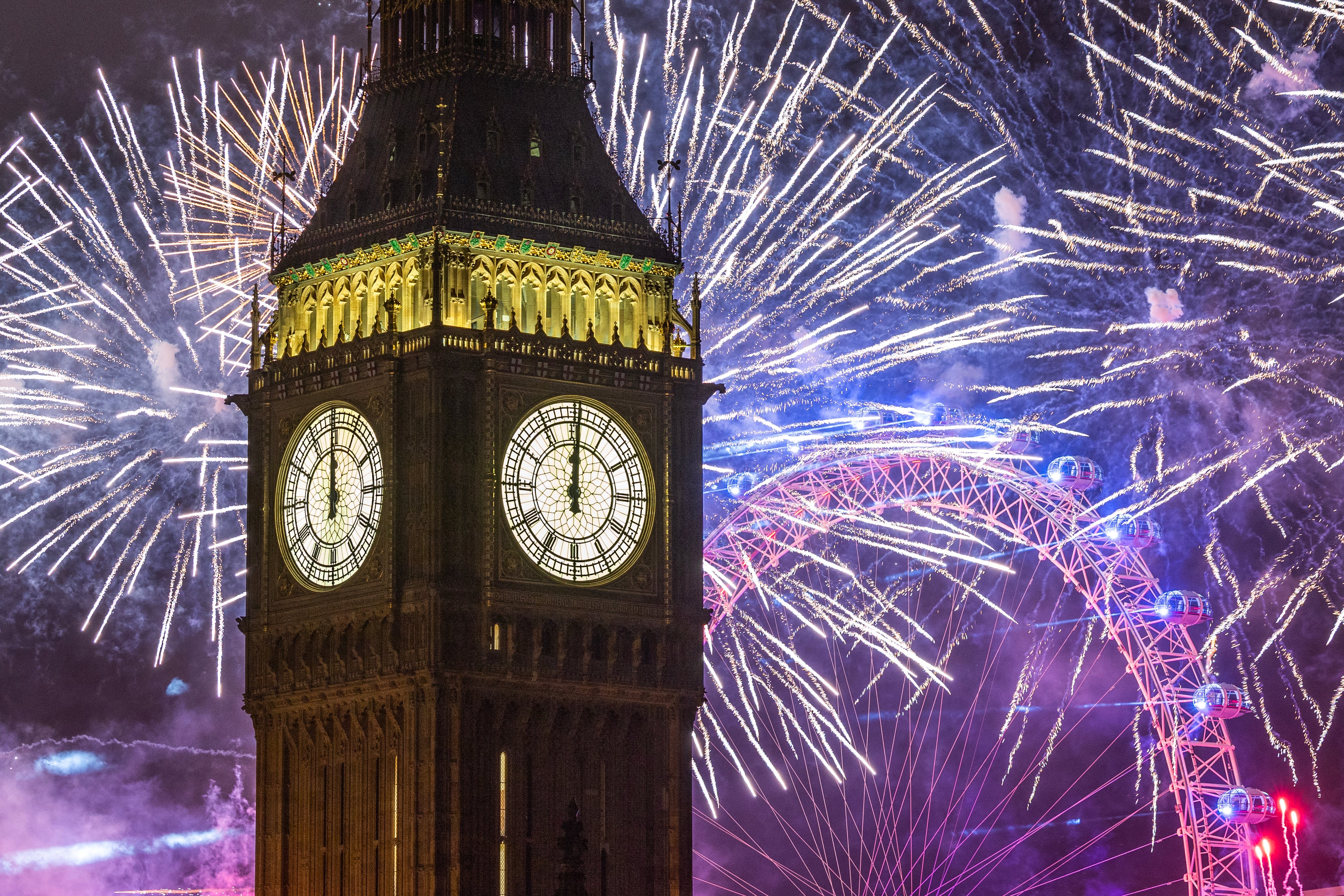 Fireworks light up the London skyline over Big Ben and the London Eye just after midnight