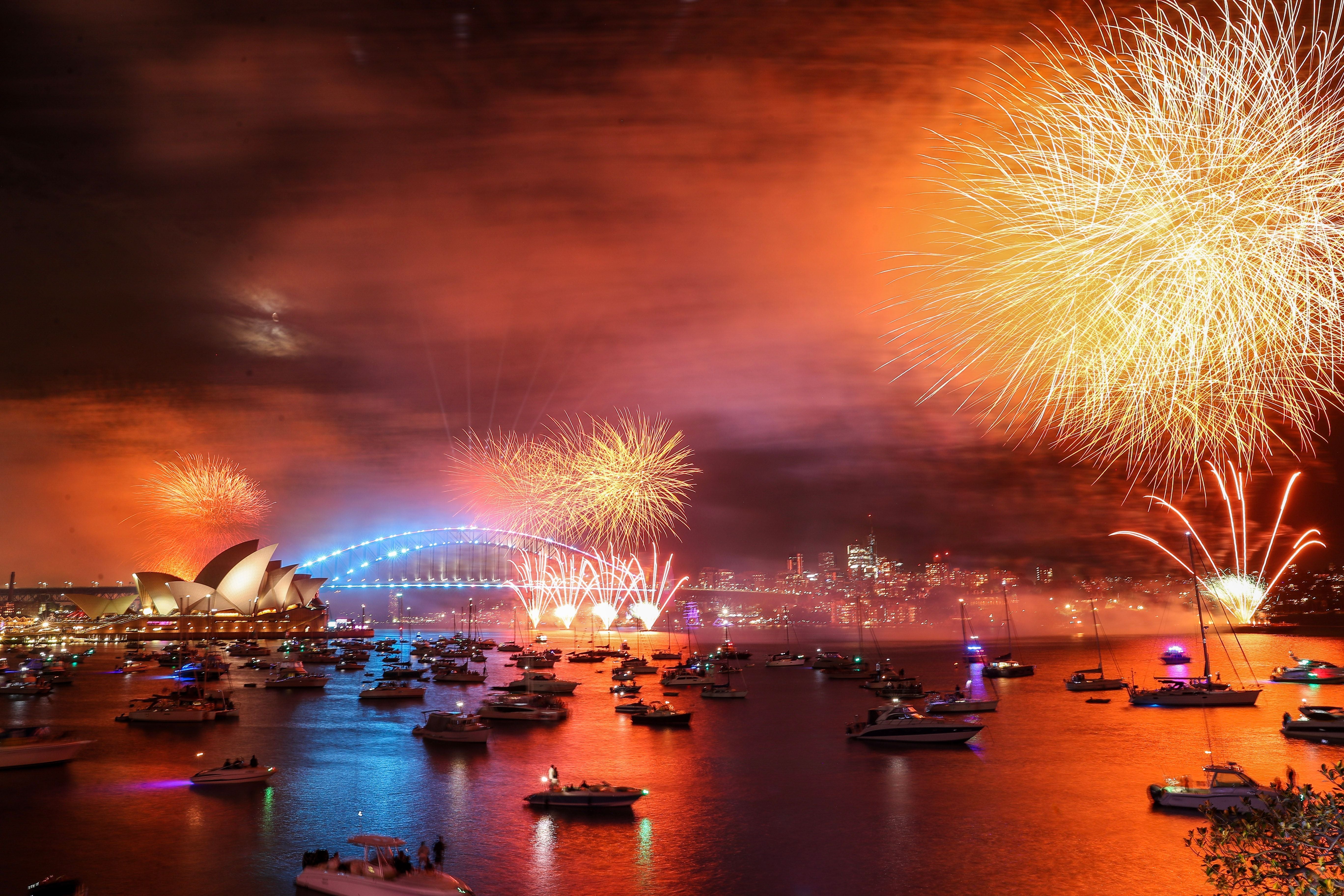 Fireworks light up the sky over Sydney Harbour Bridge during New Year’s Eve celebrations